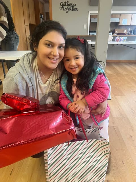 Families receiving gifts at the Romans 116 Church Christmas Giveaway (2)
