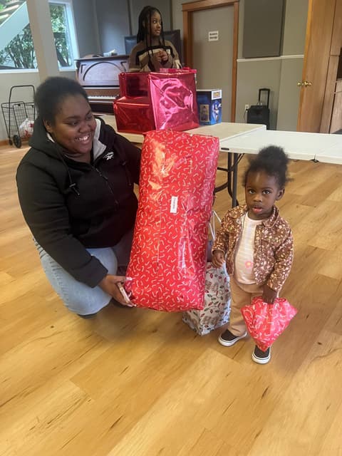 Families receiving gifts at the Romans 116 Church Christmas Giveaway (6)